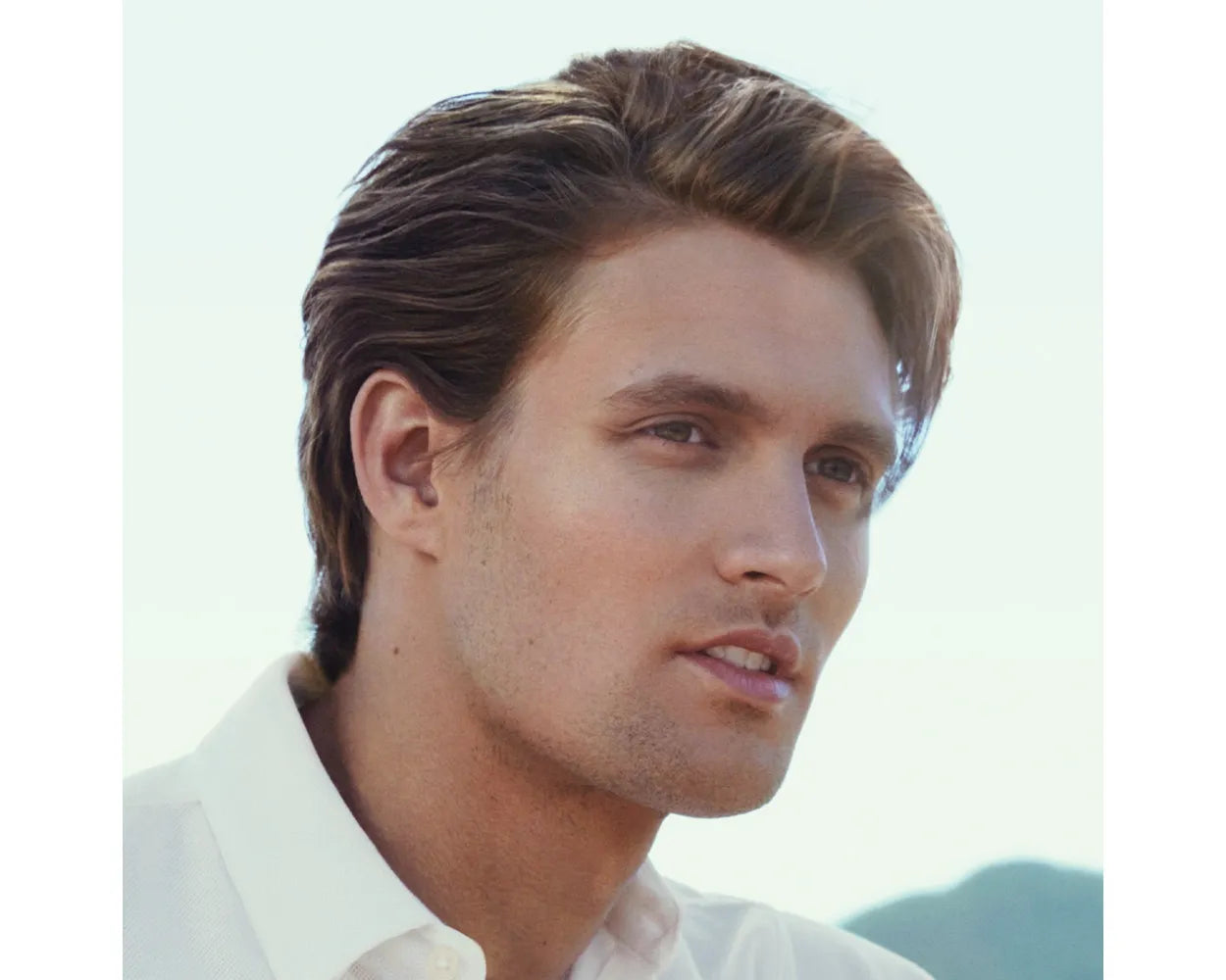 PAUL MITCHELL Tea Tree Lemon Sage Thickening Spray. Male model with styled hair.